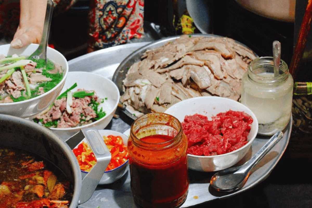 A small pho street stall appears on a Hanoi sidewalk as the city wakes up